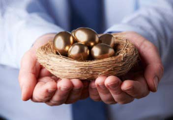 hands holding gold eggs